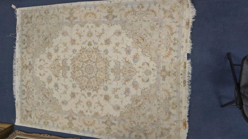 A Persian ivory ground part silk rug, 210 x 150cm